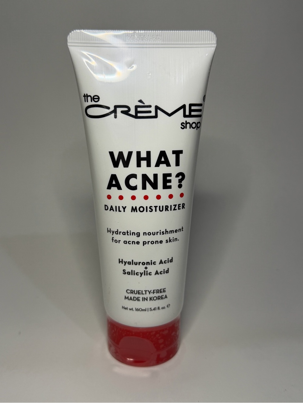 The Crème Shop What Acne? Daily Moisturizer — White with Red Accents